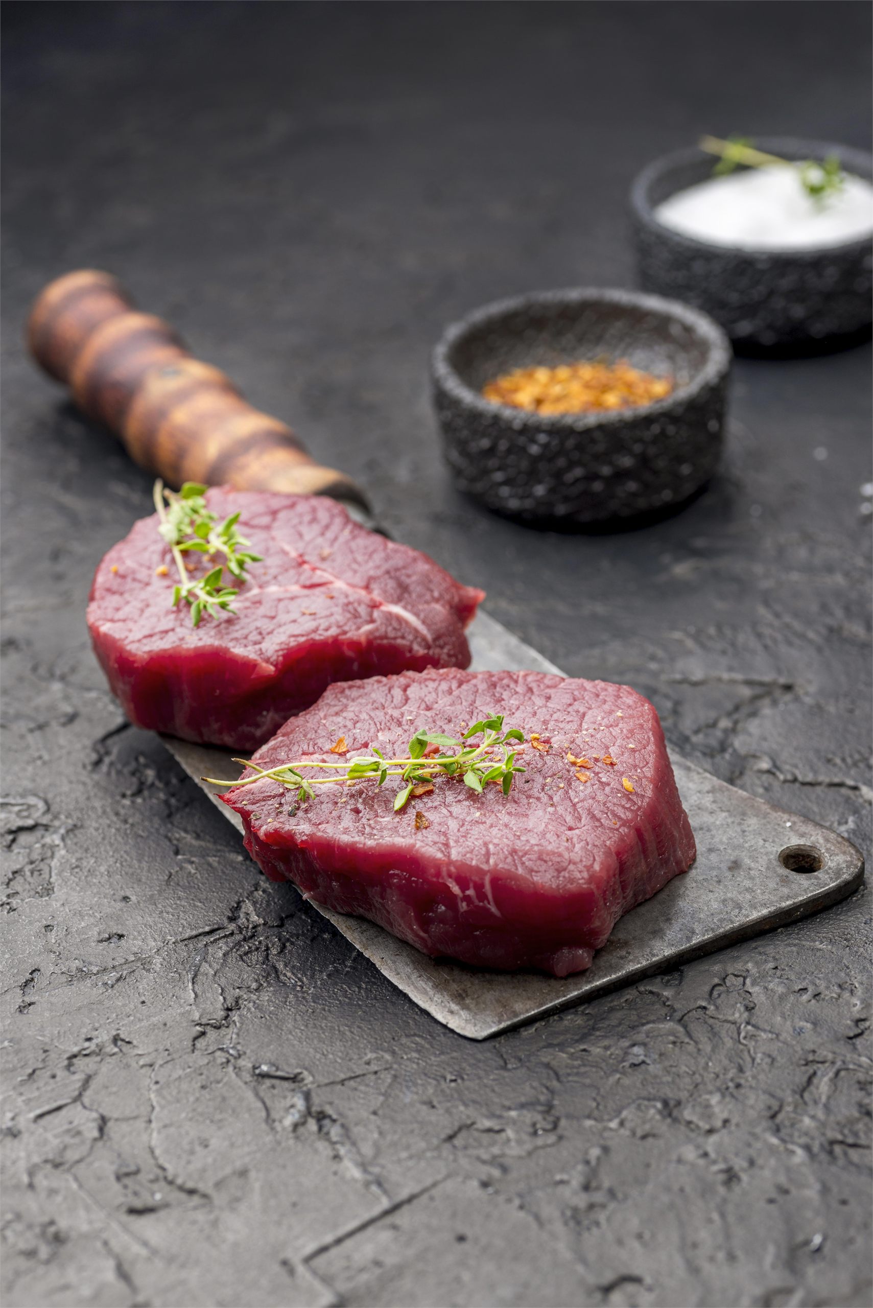 Sliced steak served with herbs at Cork & Cleaver