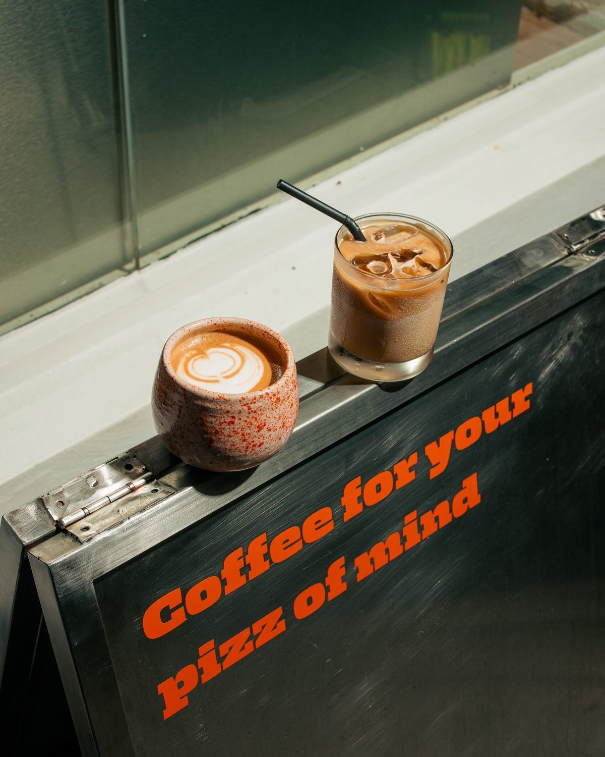 Hot and iced coffee on the counter at Mokky's Pizza