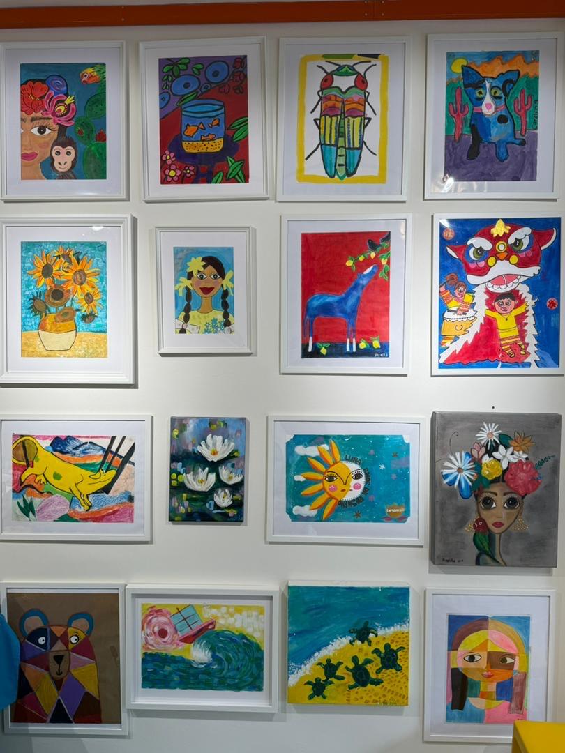 Wall of colourful artwork at Limoncito