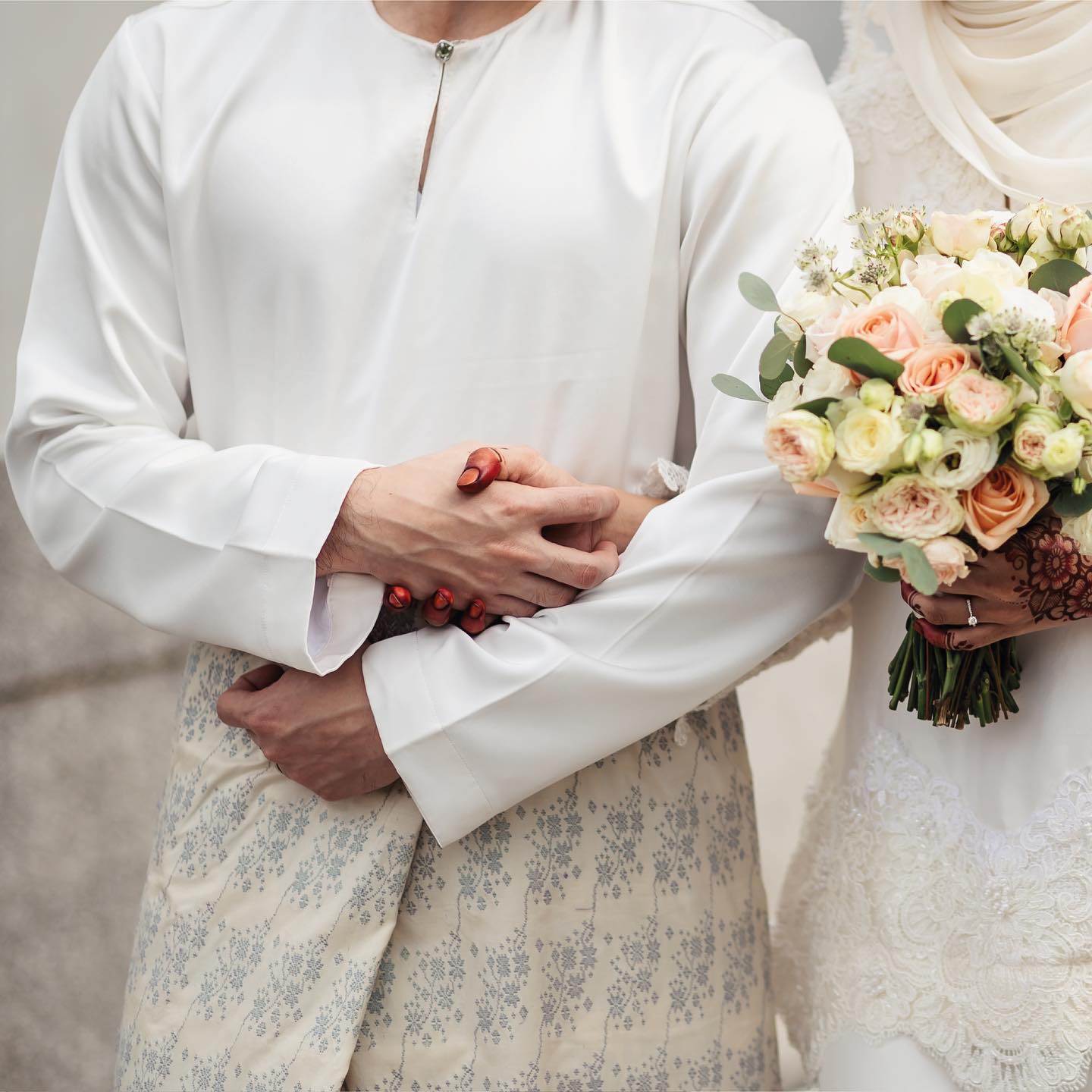 Groom in traditional attire by Omar Ali