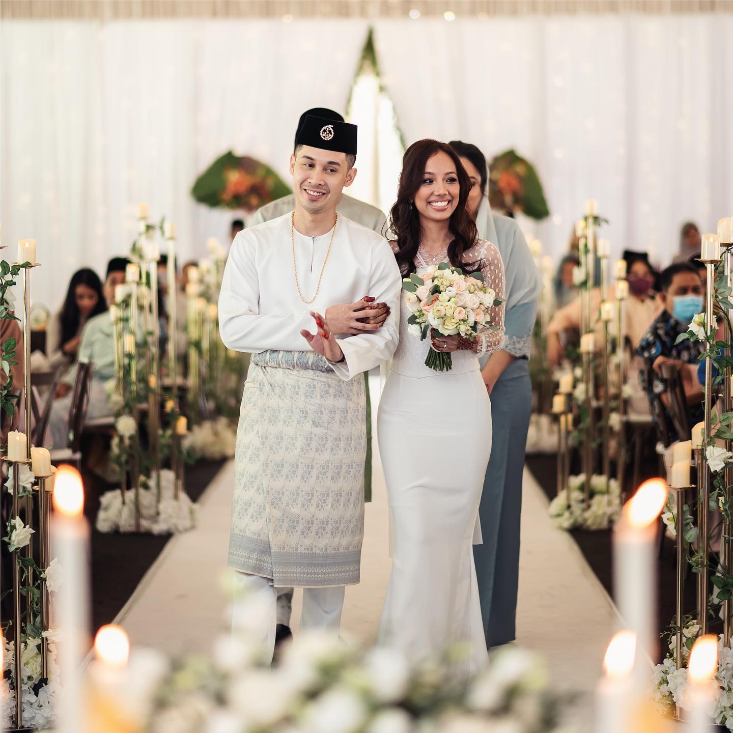 Wedding party in matching traditional attire by Omar Ali